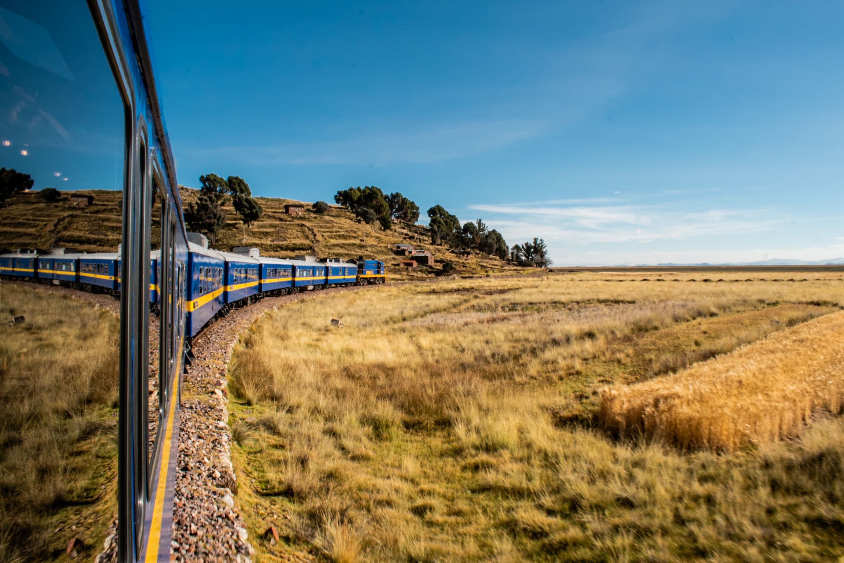 Train crossing the Puno landscape